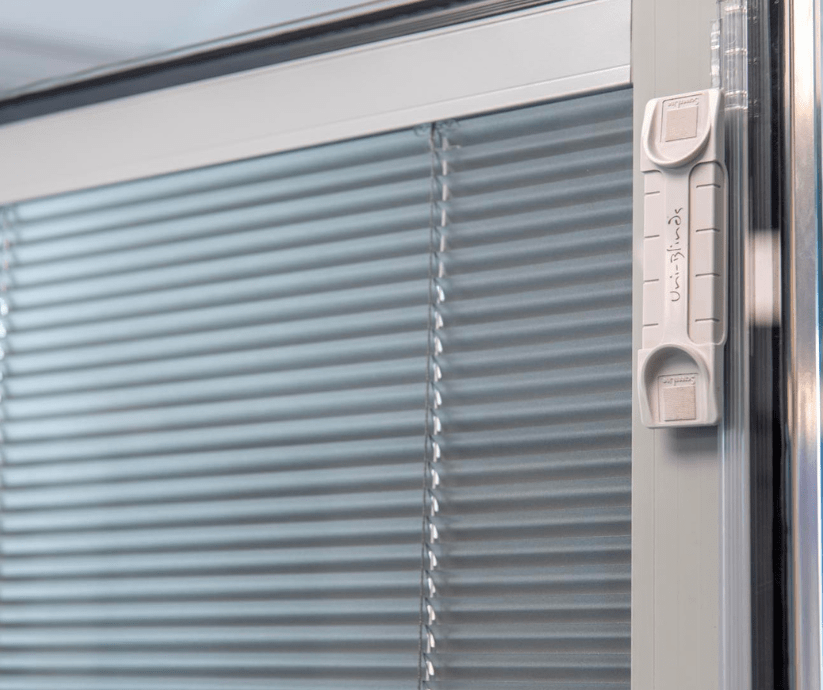 Integral blinds for sliding and bifold doors supplied by Sapphire Windows & Doors.