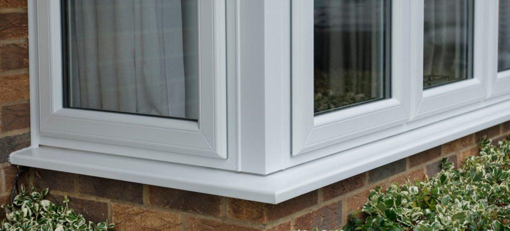 Heritage sculptured sash window with outward-opening sashes and traditional equal sightlines for an authentic period property appearance.